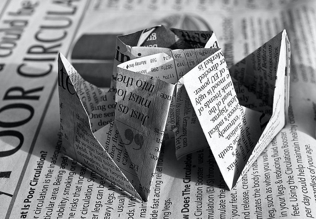 origami shape made from newspaper