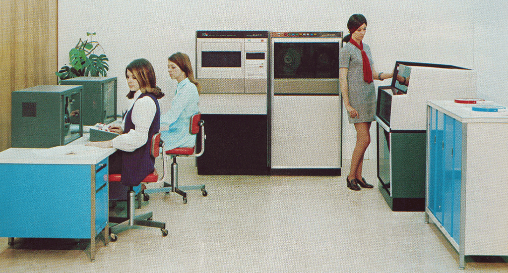 Image of MDS 2400 system with consoles, CPU, tape drive and printer.