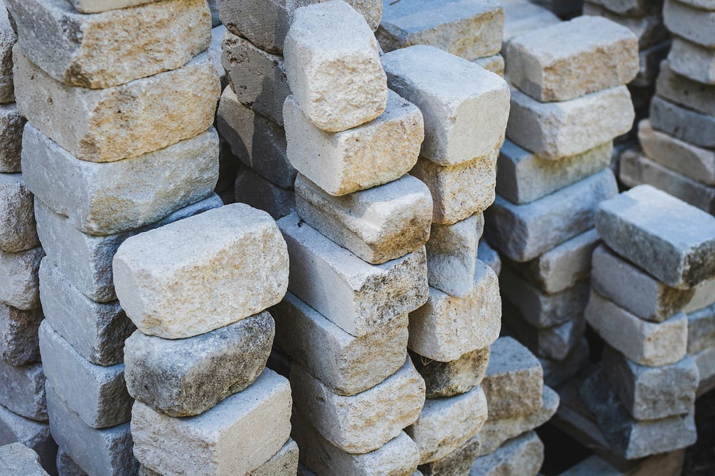 Photo by <a href=”https://unsplash.com/@greg_rosenke?utm_content=creditCopyText&utm_medium=referral&utm_source=unsplash">Greg Rosenke</a> on <a href=”https://unsplash.com/photos/stack-of-gray-and-brown-rocks-vrNA810gF3s?utm_content=creditCopyText&utm_medium=referral&utm_source=unsplash">Unsplash</a>