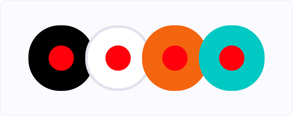 Four differently colored circles with red dots inside them. Showing how the red color changes when surrounded by different colors.