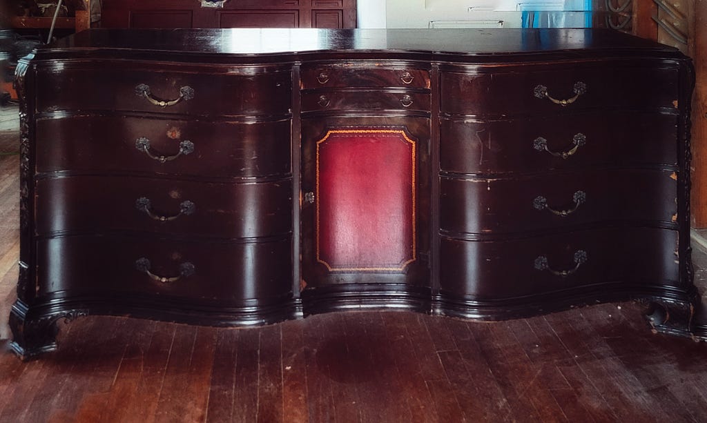 Vintage wooden dresser with red center panel