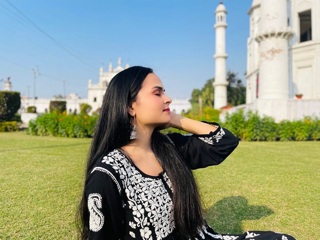 A picture of me sitting in the lush gardens of Chota Imambara, Lucknow.