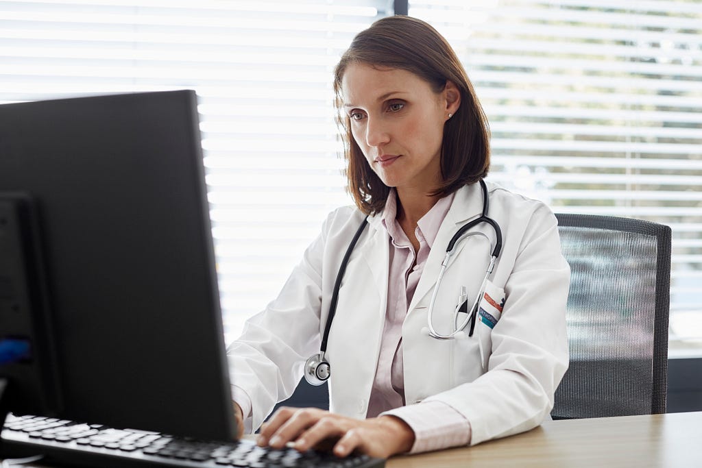 Female doctor working on computer