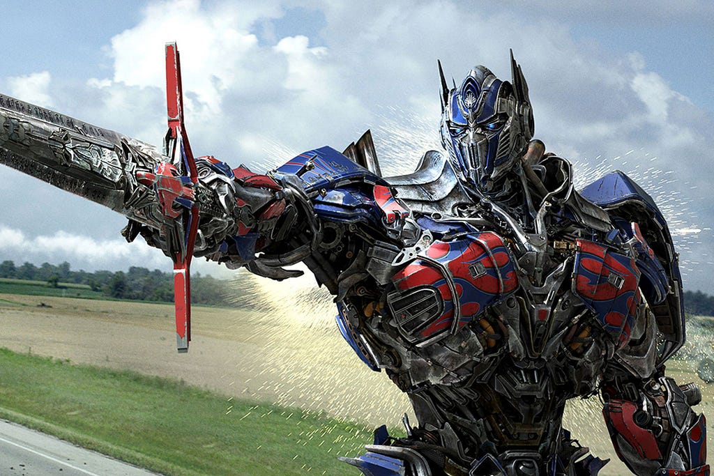 Optimus Prime pointing a sword in Transformers: The Last Knight.