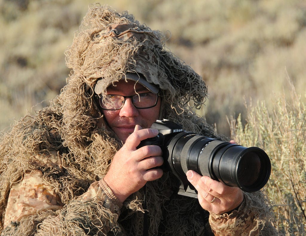 Tom Koerner, in his camoflauge ghillie suit, is one with his surroundings.