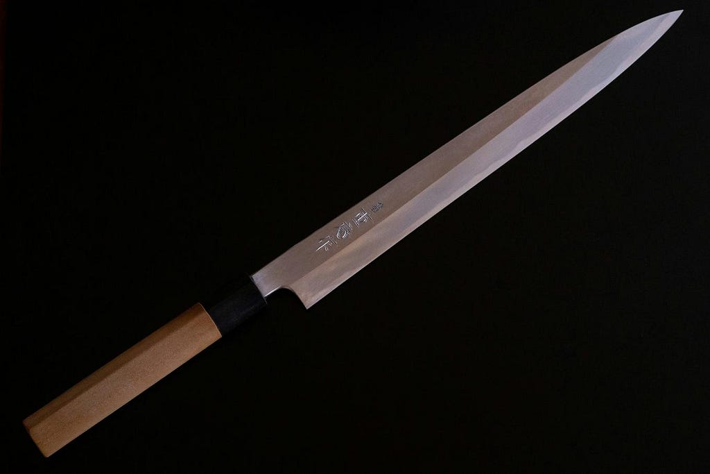 Finely sharpened blade, showcasing its gleaming, razor-sharp edge.