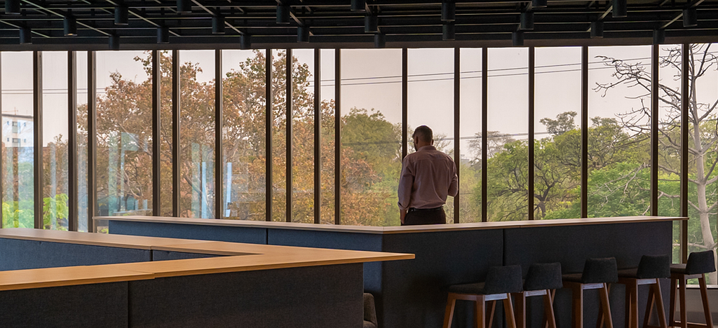 A man standing by the window at Daftarkhwan | Downtown.