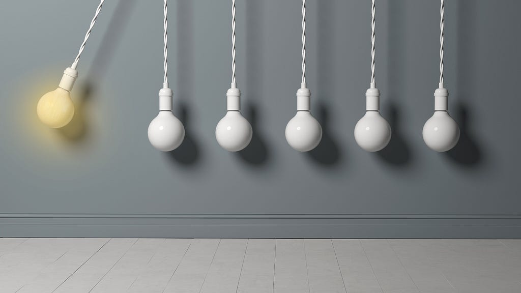 Light bulb as a pendulum, hitting other lightbulbs like in a newton cradle.