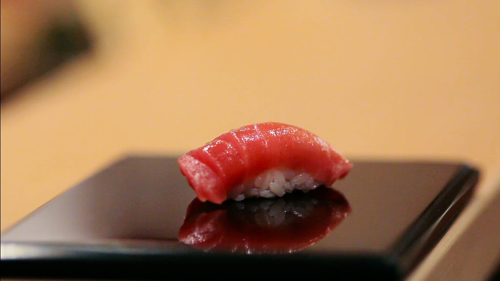 A picture of one of Jiro’s immaculately crafted sushi pieces
