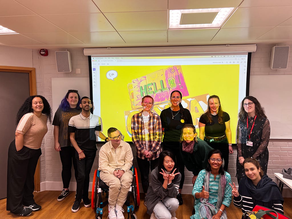 A group photo of members of CYA and students at Warwick University.