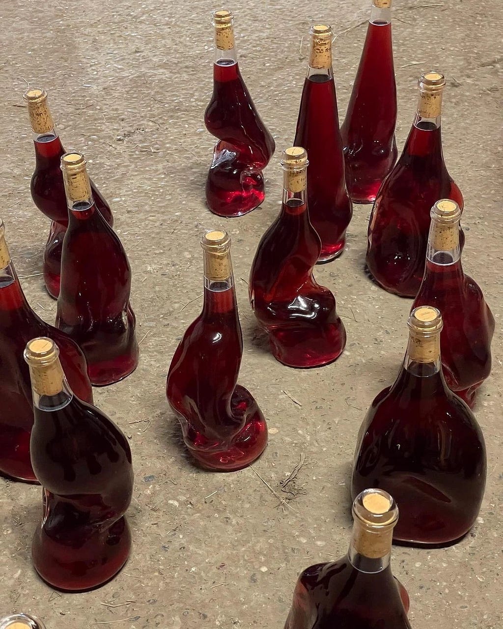 Disfigured bottles of red wine