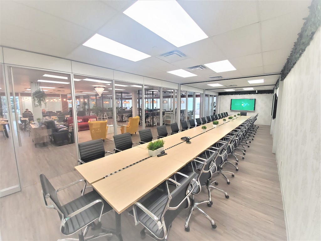 Touchdown Coworking Space Conference Room — Seats 34 people, is 572 sqft and 44 feet long.