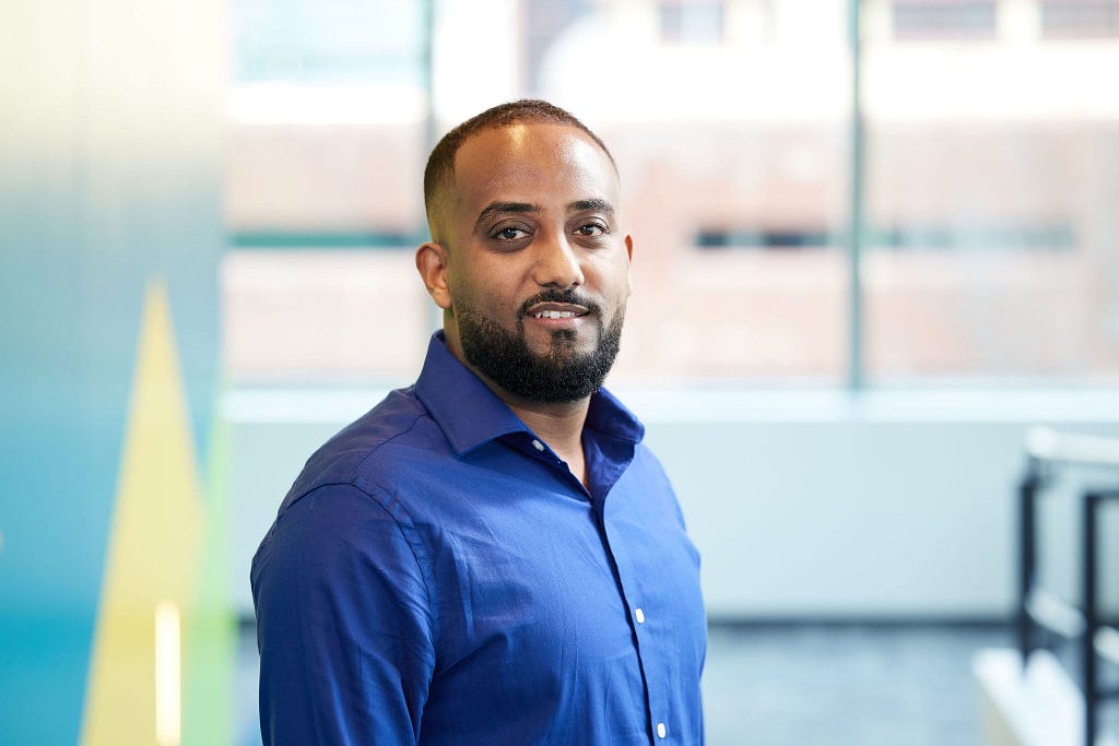 Yonas Mekonnen smiles at camera.