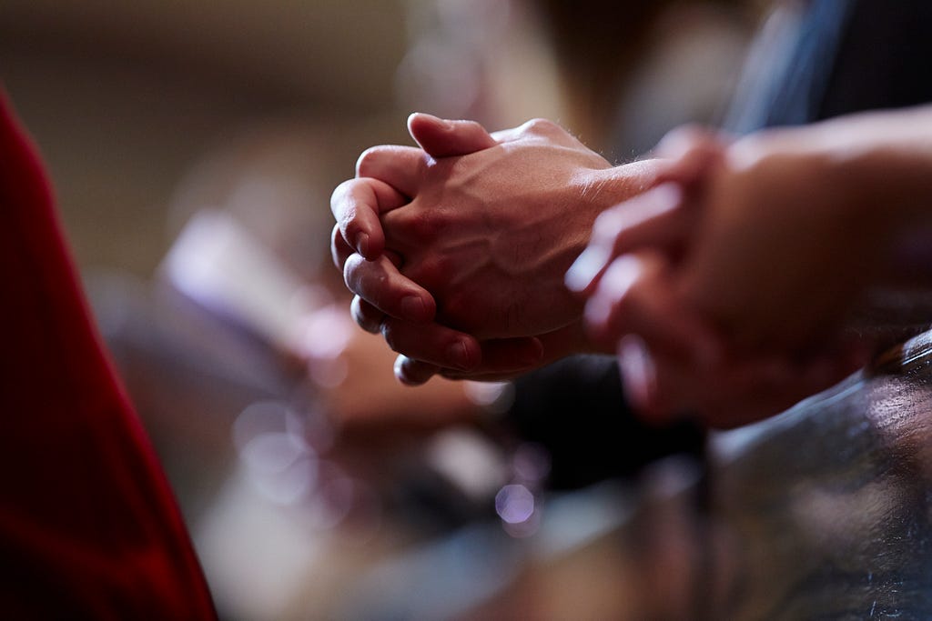 Students praying at The Church of the Gesu on Marquette University’s campus.