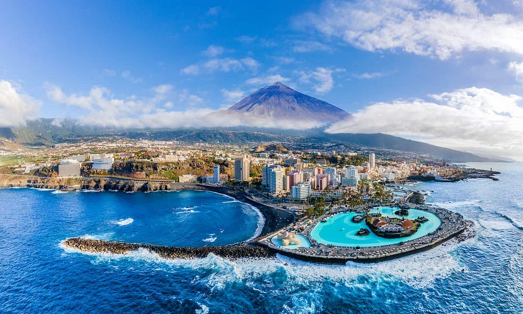 View of Puerto de la Cruz with the Mount Teide in the back, Tenerife. Getty Images.
