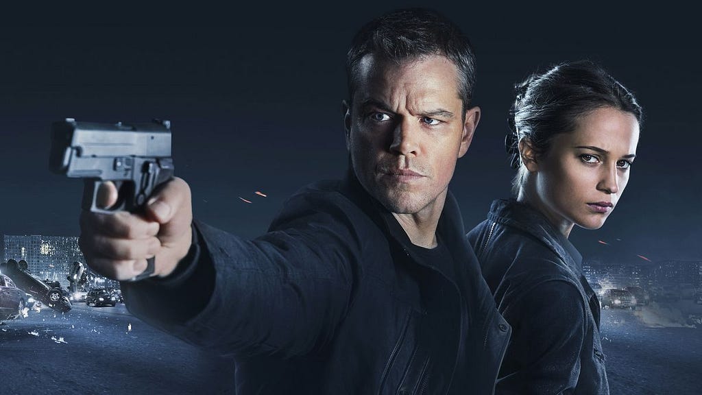 Jason Bourne pointing a gun in a promotional image.