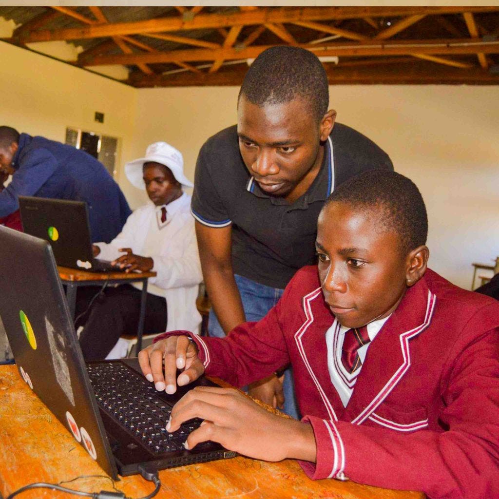 Teaching high school kids in Zimbabwe how to code in Python during my freshman summer.
