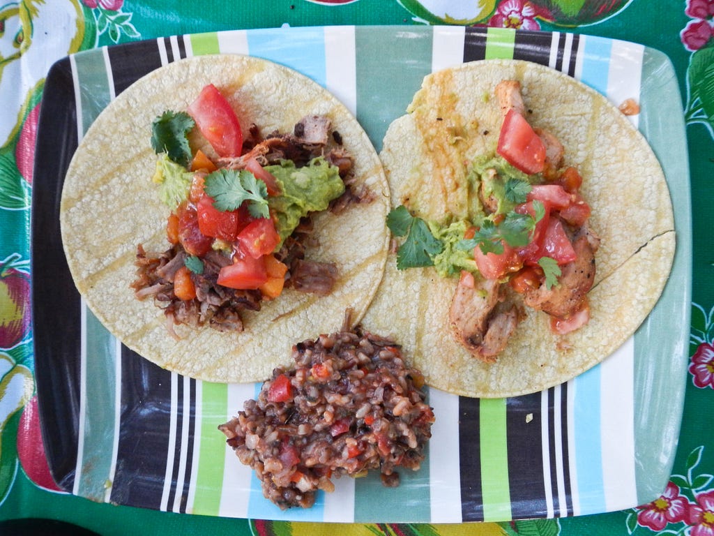 This “gourmet” do-it-yourself camping dinner on California’s Santa Cruz Island in Channel Islands National Park included Spanish rice and chicken tacos with guacamole, fresh tomatoes, grated cheese and cilantro. (copyright April Orcutt — all rights reserved)