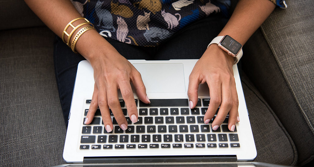 Woman typing on laptop