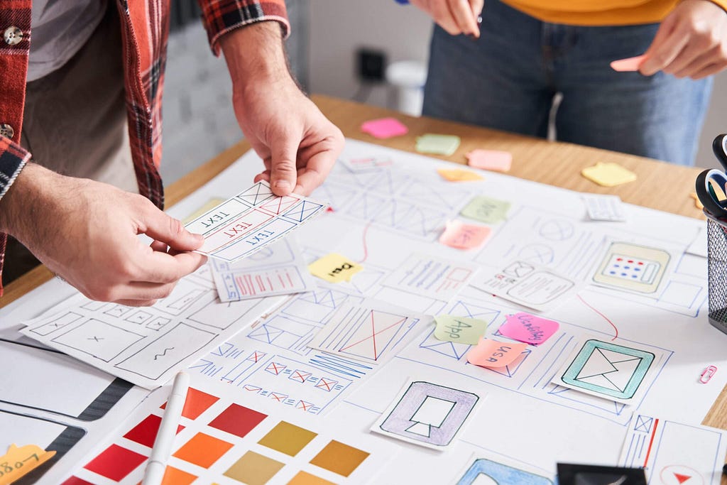 People on a meeting and formulating their action plan on an office table.