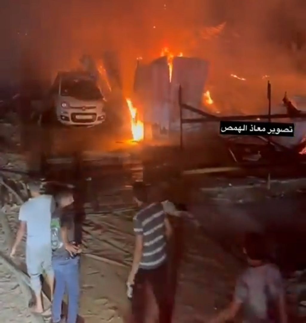 People in Rafah trying to extinguish fire that caused by Israeli soldiers.