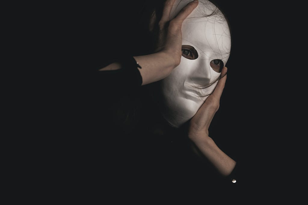 A woman putting on a mask