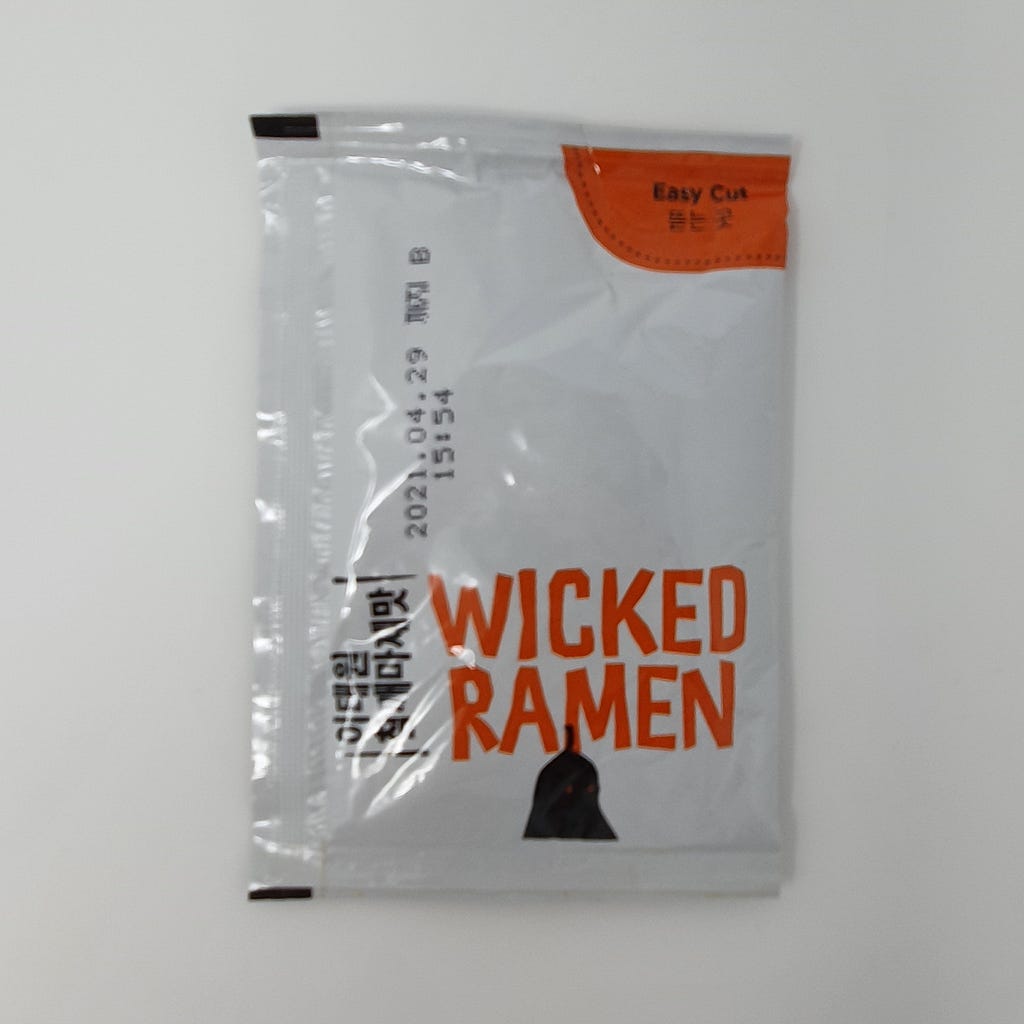 The bibim sauce packet from a package of Wicked Ramen (Yogoe Ramyeon) Itaeweon Chamggae Majemat.