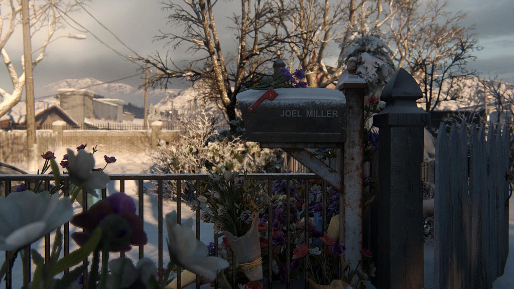 Joel Miller’s post box, with an array of flower arrangements on his porch, mounring his loss.