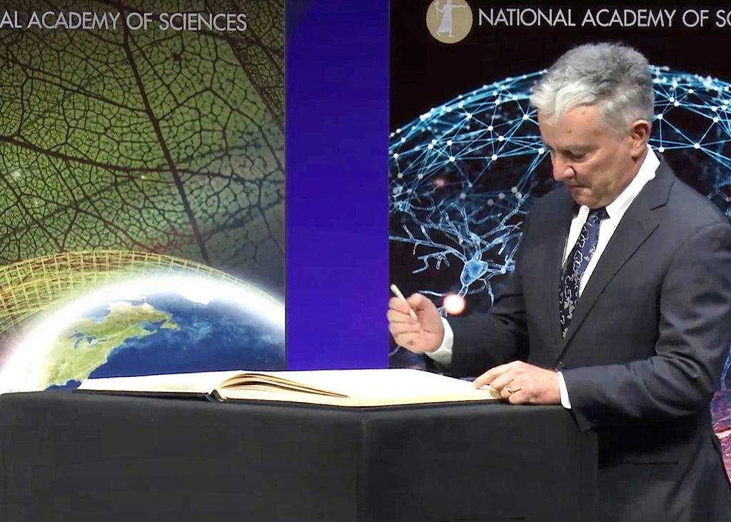 A picture of Jim Elser signing the NAS register in Washington, D.C.