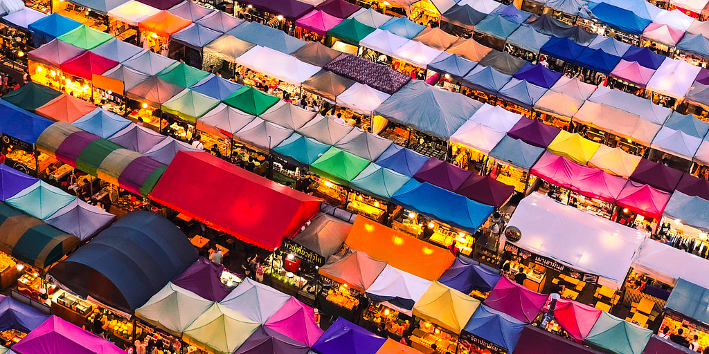 Photograph of a marketplace, courtesy Lishen Chang on Unsplash