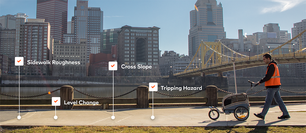 An image of a person pushing pathMet along sidewalks in the City of Pittsburgh to map accessibility.