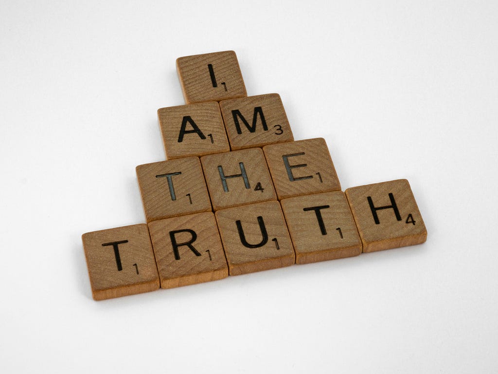 You can only live your truth, even if you’re hiding or not disclosing certain parts. Wooden letter tiles spell out the phrase “I am the truth”. [Credit: Brett Jordon on Unsplash]