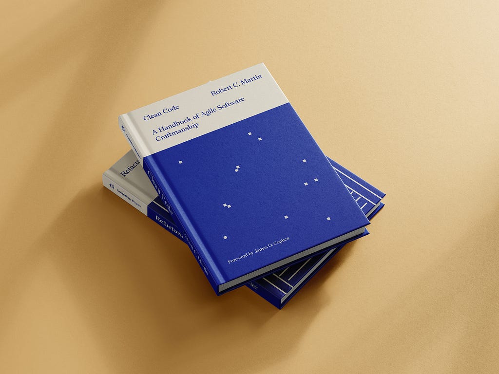 Mockup of two books, one on top of the other. On the top is ‘Clean Code’ by Robert C. Martin. It showcases the cover, redesigned by María Simó, on cream and electric blue tones and some dots resembling pixels or constellations.