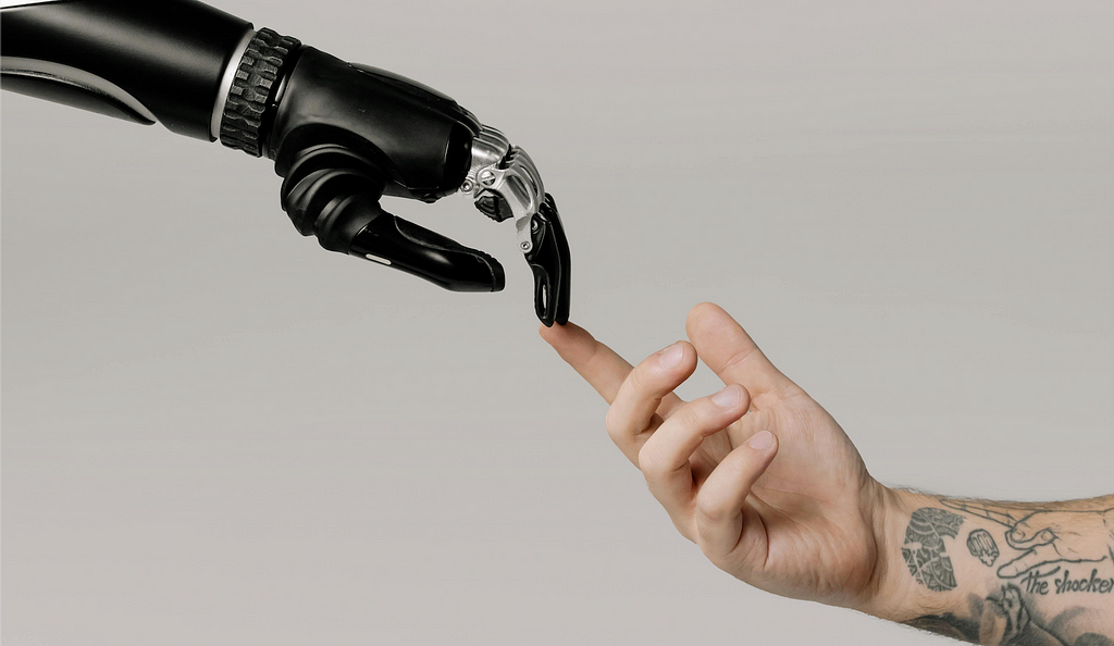 Robot hand touching human hand