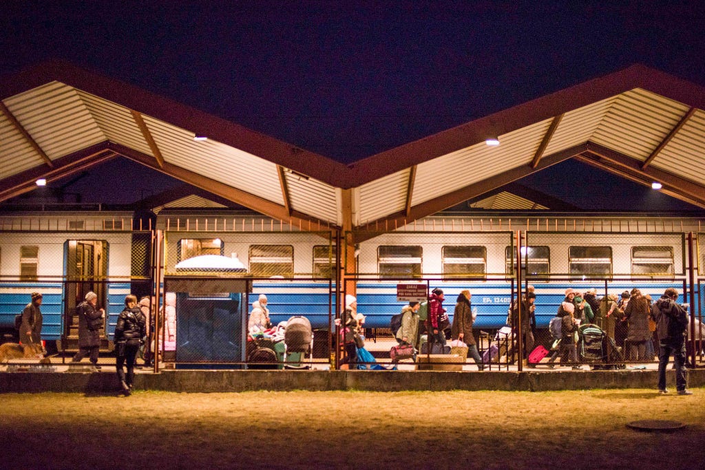 Ukrainian refugees arrive at the Przemysl, Poland, train station, March 3, 2022. Photo by Attila Husejnow/SOPA Images/Alamy