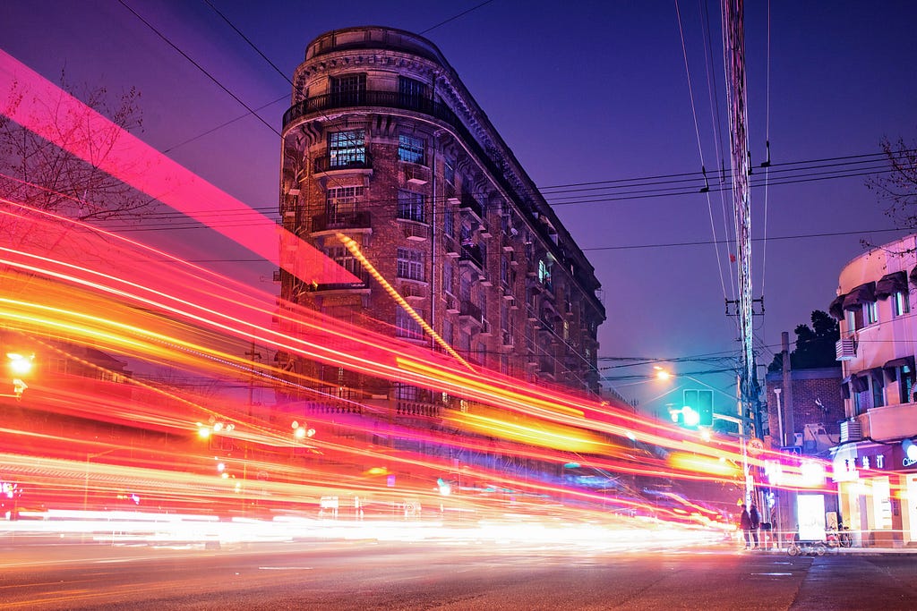 Headlights in motion on an urban street