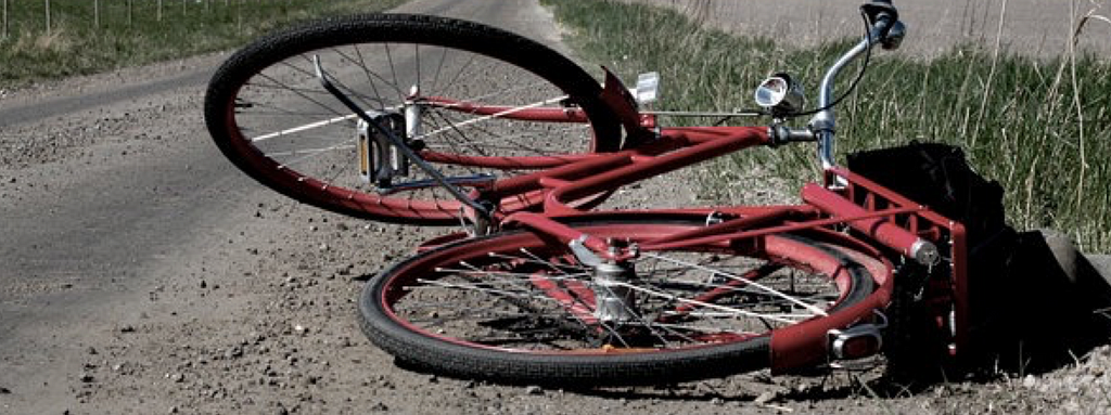 Bicycle laying down on gravel