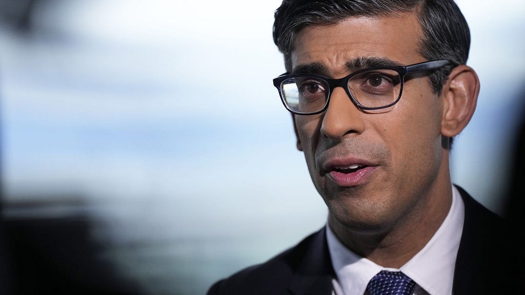 photo of Rishi Sunak wearing glasses