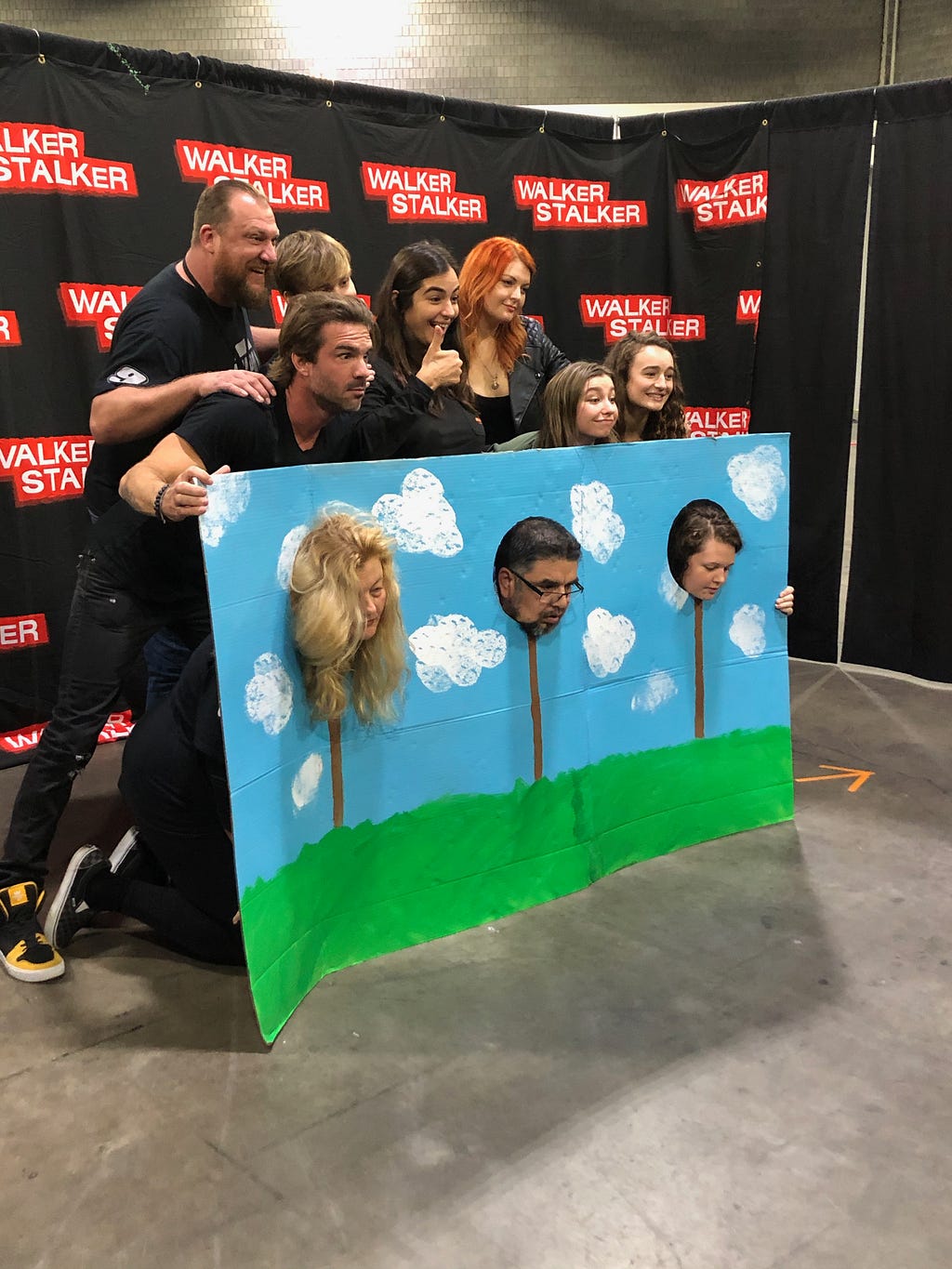 Fans pose for photos with actors from The Walking Dead