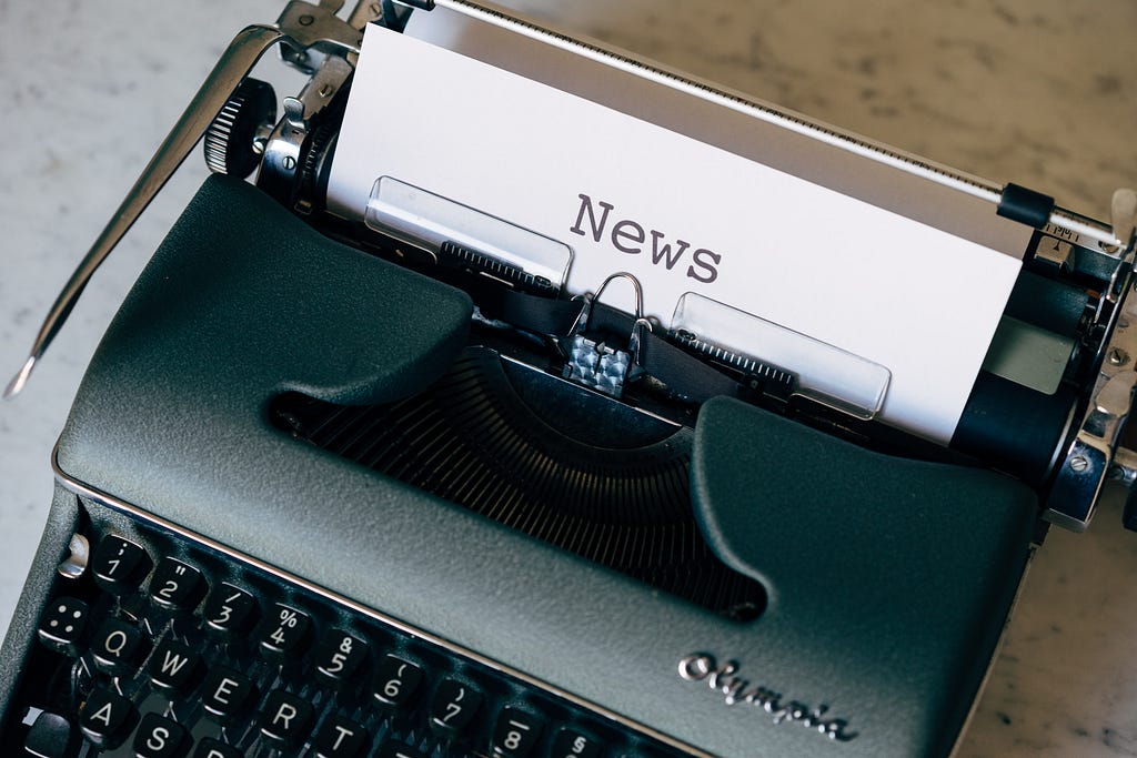 An old typewriter with “news” written on it, illustrating the power of a press release