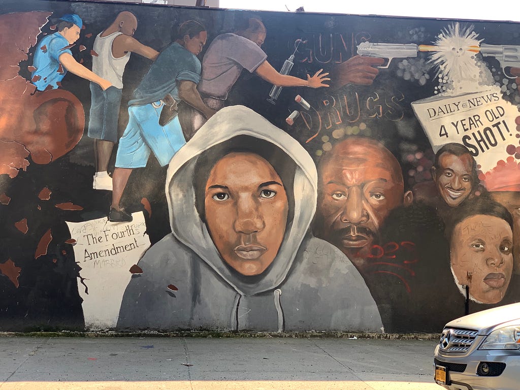 Mural of Trayvon Martin along with symbols of despair in East New York, Brooklyn.