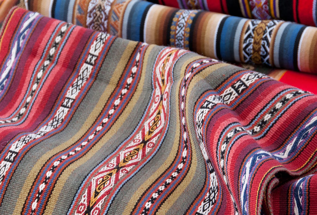 Quechuan weavings at the Sunday Market in Chinchero, Peru. (© April Orcutt. All Rights Reserved)