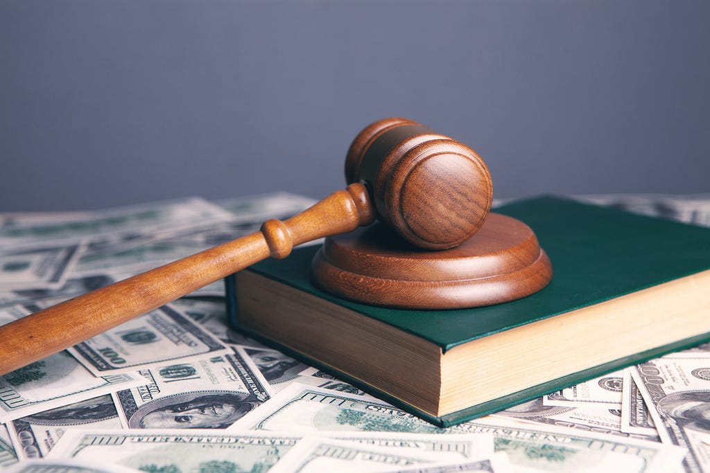a wooden gavel on a book (AI lawsuits)