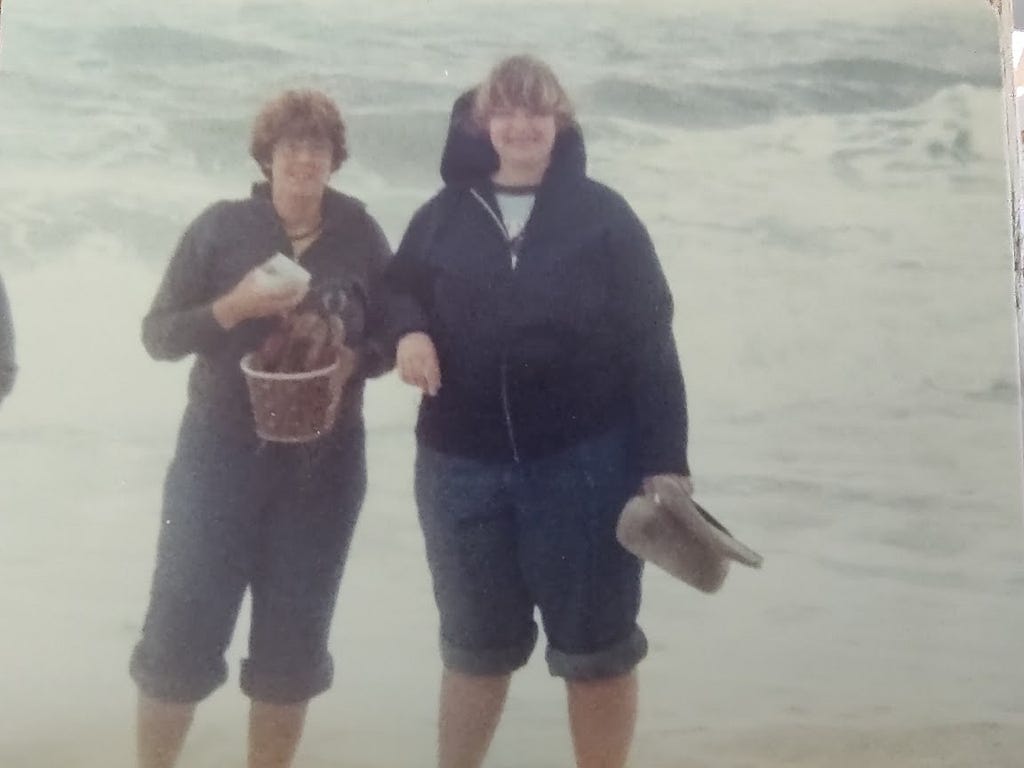 Picture of my cousin Anne and I standing in front of the ocean