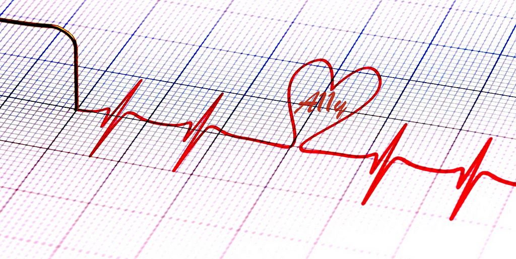 The graphic trace of a heartbeat with a heart shape in it and the word ‘A11y’ inside the heart