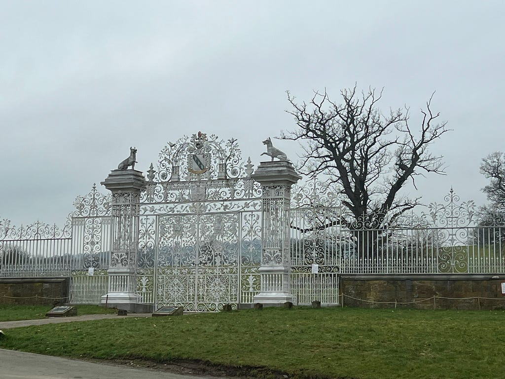 Massive white gates at Chirk Castle in Wales.
