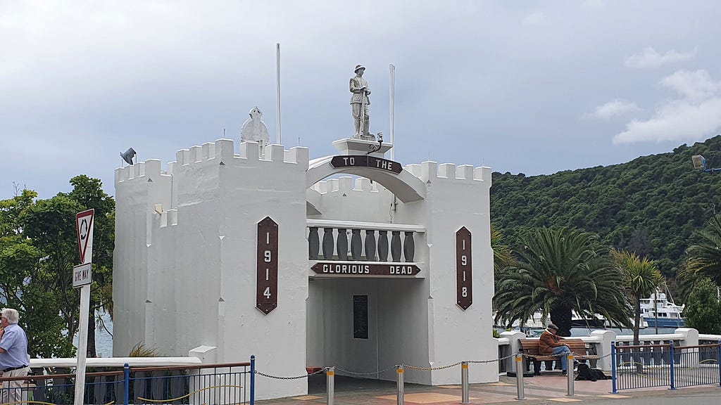 To the Glorious Dead, WWI war memorial in Picton NZ. Later altered to honour those who served in other wars. Approaching the town from the seaward side, the inscription is “Peace, perfect peace”. Photo by author.