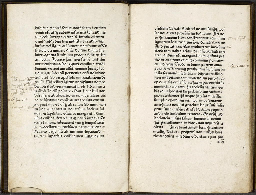 Double page of text written in Latin with handwritten annotations in the margins