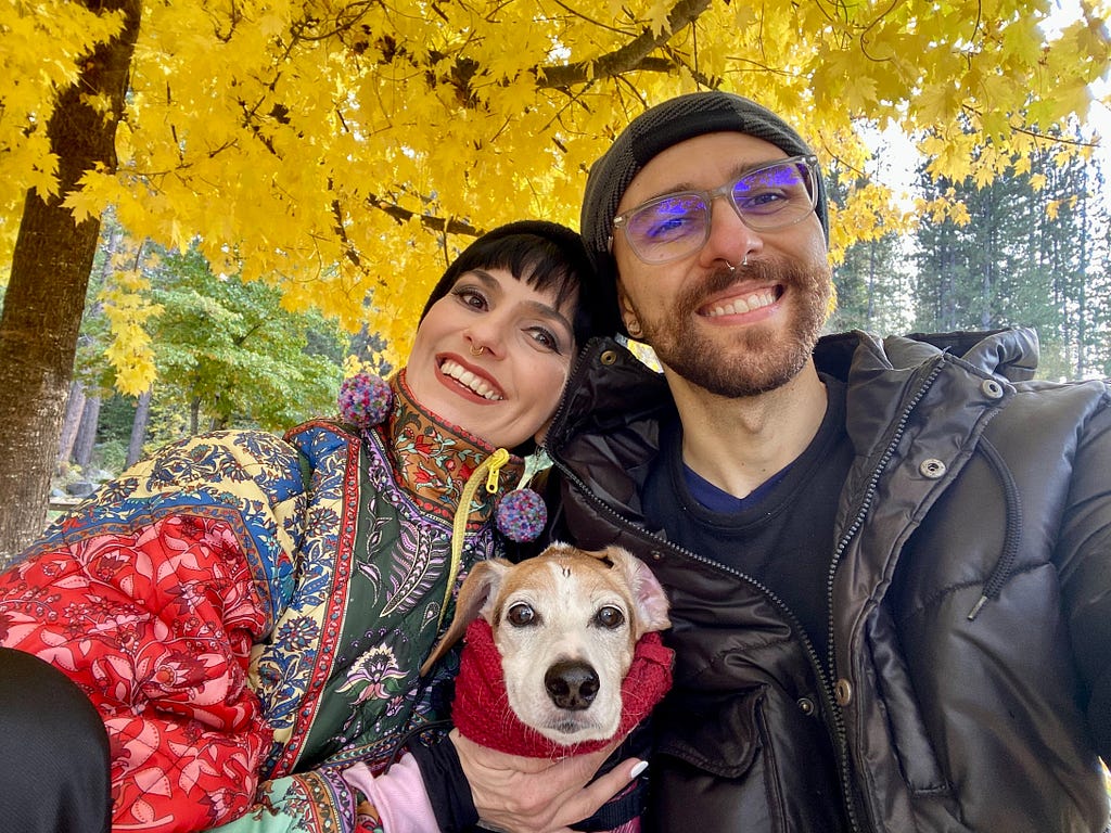 Cíntia Romero with her husband Tiago and pet beagle named Sherlock.