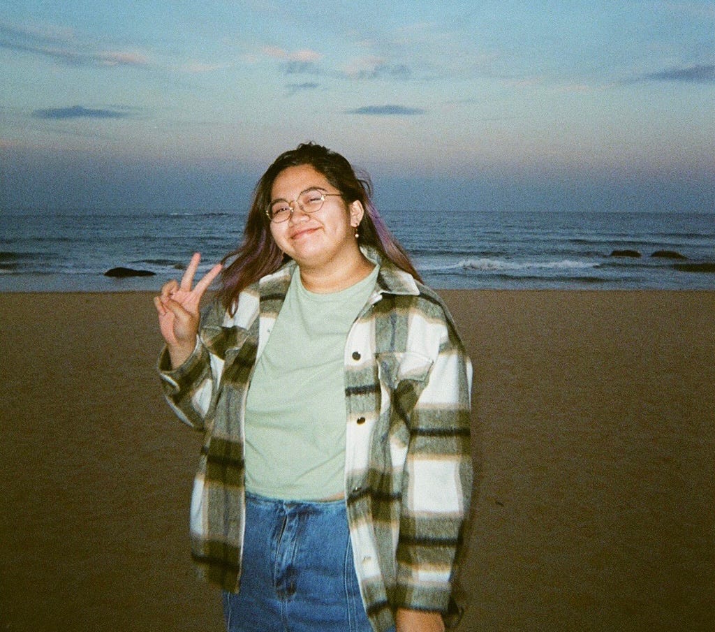 Picture of Meredith Quintana with the backdrop of a beach